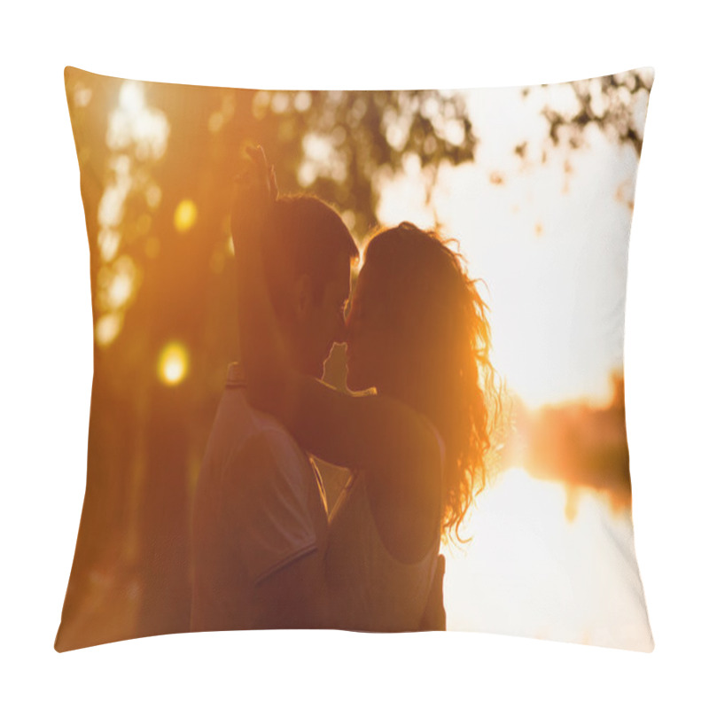 Personality  young beautiful couple embracing on a white background of a sunset pillow covers