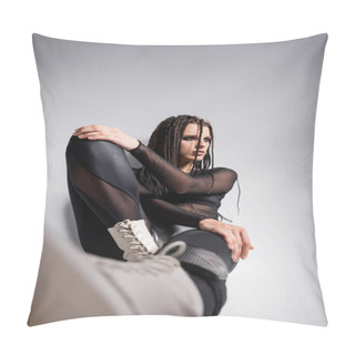 Personality  Trendy Woman With Dreadlocks Sitting In Black Futuristic Outfit On Grey Background Pillow Covers