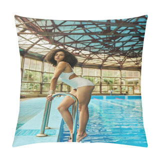 Personality  Young And Curly African American Woman In Bathing Suit Standing By Pool Ladder With Blue Water Pillow Covers