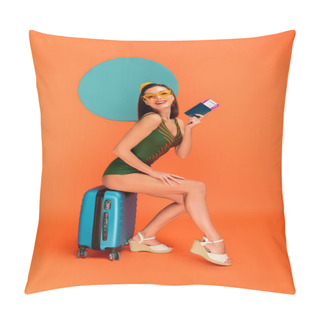 Personality  Girl With Passport And Air Ticket Smiling, Looking At Camera And Sitting On Suitcase With Blue Circle Behind On Orange  Pillow Covers