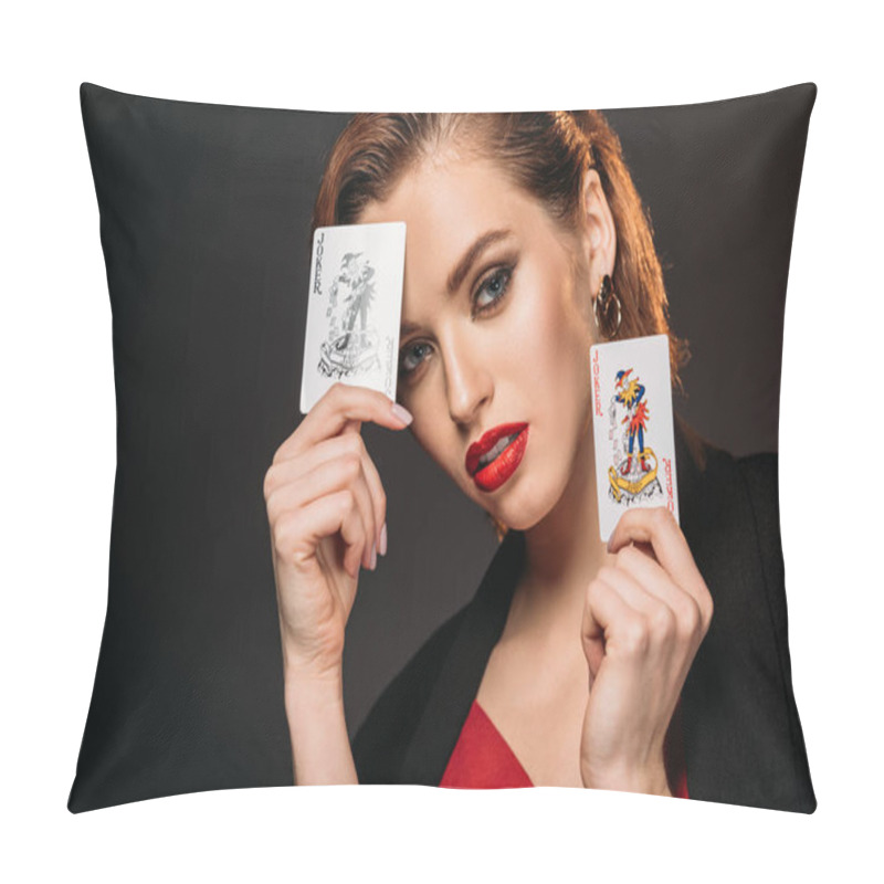 Personality  portrait of attractive girl in red dress and black jacket holding playing cards isolated on black pillow covers