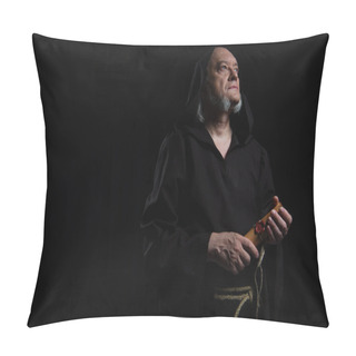 Personality  Senior Monk With Rolled Manuscript Looking Away Isolated On Black Pillow Covers