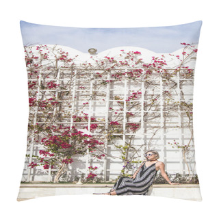Personality  Attractive Young Woman In Dress And Sunglasses Sitting And Looking Away Near While Wall With Flowers In Egypt   Pillow Covers