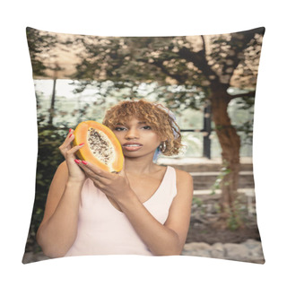 Personality  Stylish Young African American Woman In Summer Dress Holding Fresh Papaya And Looking At Camera While Standing In Blurred Indoor Garden, Stylish Lady Blending Fashion And Nature, Summer Concept Pillow Covers