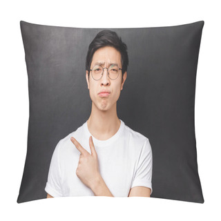 Personality  Close-up Portrait Of Picky, Skeptical And Gloomy Asian Guy In Glasses, Grimacing Unsatisfied, Look Disappointed At Camera While Pointing Finger Left At Something Unpleasant And Uncool Pillow Covers