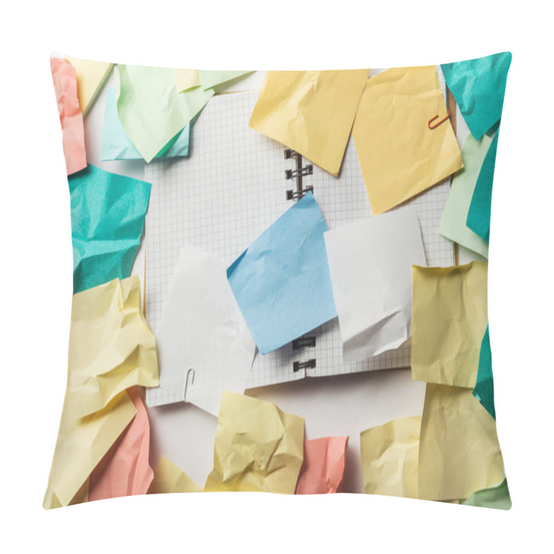 Personality  top view of opened notebook with squared papers near crumpled sticky notes  pillow covers