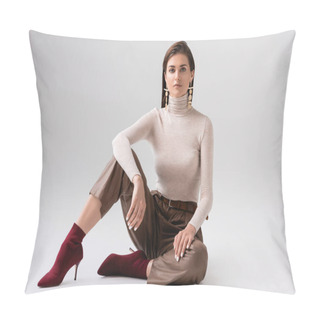 Personality  Attractive, Stylish Woman Sitting On Floor And Looking At Camera On Grey Pillow Covers