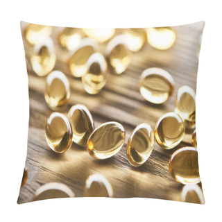 Personality  Close Up View Of Golden Fish Oil Capsules Scattered On Wooden Table Pillow Covers