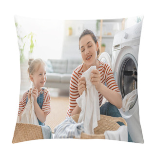 Personality  Beautiful Young Woman And Child Girl Little Helper Are Having Fun And Smiling While Doing Laundry At Home. Pillow Covers