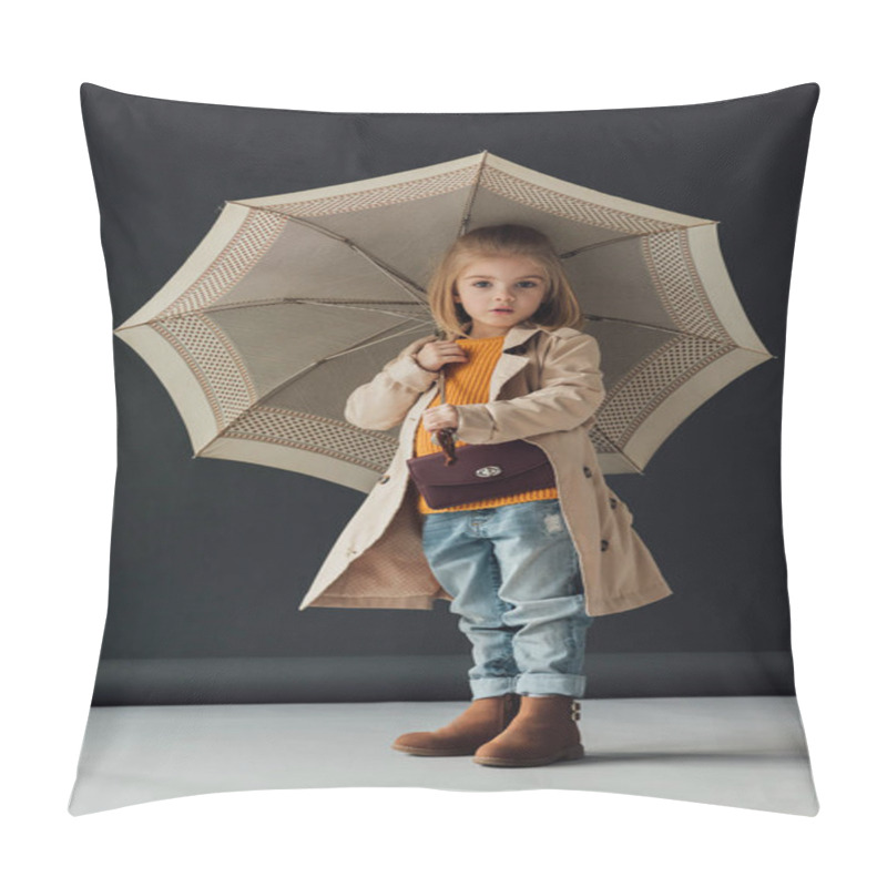 Personality  surprised child in trench coat and jeans holding umbrella and looking at camera  pillow covers