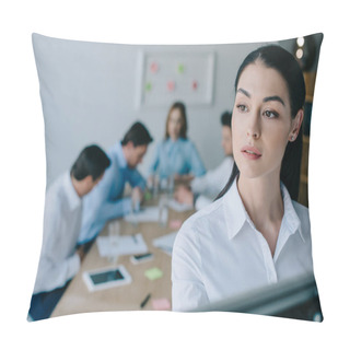Personality  Selective Focus Of Pensive Businesswoman And Colleagues Behind At Workplace In Office Pillow Covers