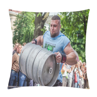 Personality  LVIV, UKRAINE - JUNE 2016: Athlete Bodybuilder Strongman With Strong Body Has An Enormous Metal Barrel With Beer Pillow Covers