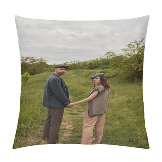 Personality  Fashionable Bearded Man In Jacket And Newsboy Cap Holding Hand Of Brunette Girlfriend And Looking At Camera With Landscape And Overcast At Background, Stylish Couple In Rural Setting Pillow Covers