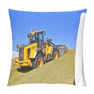 Personality  Kalush, Ukraine September 14, 2017: Ramming Of Corn Silage In The Silo Trench On A Dairy Farm Near The Town Of Kalush, Western Ukraine. Pillow Covers