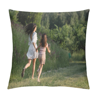 Personality  Back View Of Mother And Child Holding Hands And Running On Grassy Path Towards Forest Pillow Covers