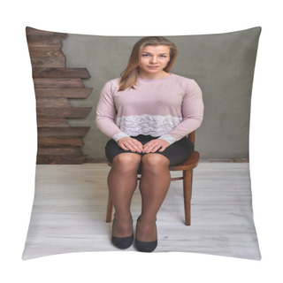 Personality  Portrait Of A Pretty Blonde Girl In A Pink Sweater And Black Skirt On An Alternative Background In Vintage Interior. Cute Looks At The Camera, Sitting On A Chair Straight. Pillow Covers