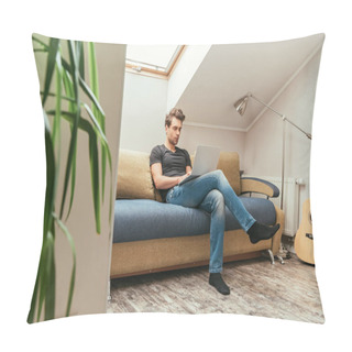 Personality  Selective Focus Of Handsome Man Using Laptop While Sitting On Sofa In Attic Room Pillow Covers