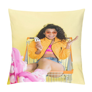 Personality  Amazed African American Woman In Pink Roller Skates Holding Ice Cream Cone While Sitting In Shopping Cart On Yellow Pillow Covers