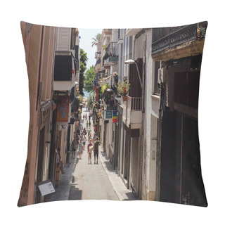 Personality  CATALONIA, SPAIN - APRIL 30, 2020: People Walking On Urban Street Near Houses With Plants On Balcony Pillow Covers