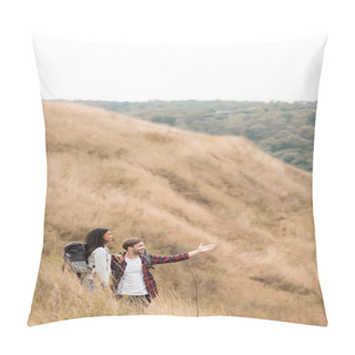 Personality  Smiling Man Pointing With Hand While Standing Near African American Girlfriend With Backpack On Hill  Pillow Covers