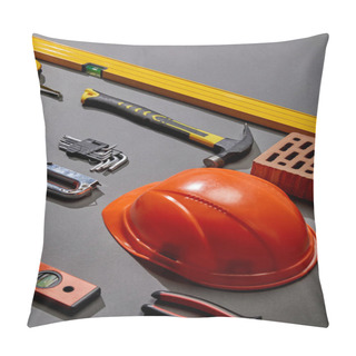 Personality  High Angle View Of Orange Helmet, Hammer, Spirit Levels, Brick, Angle Keys, Pliers, Stapler And Measuring Tape On Grey Background Pillow Covers