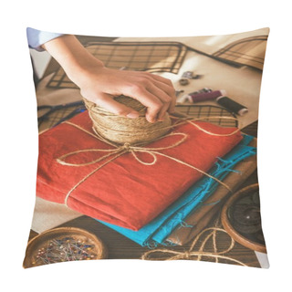 Personality  Cropped Image Of Seamstress Palming Hand On Spool Of Thread Pillow Covers