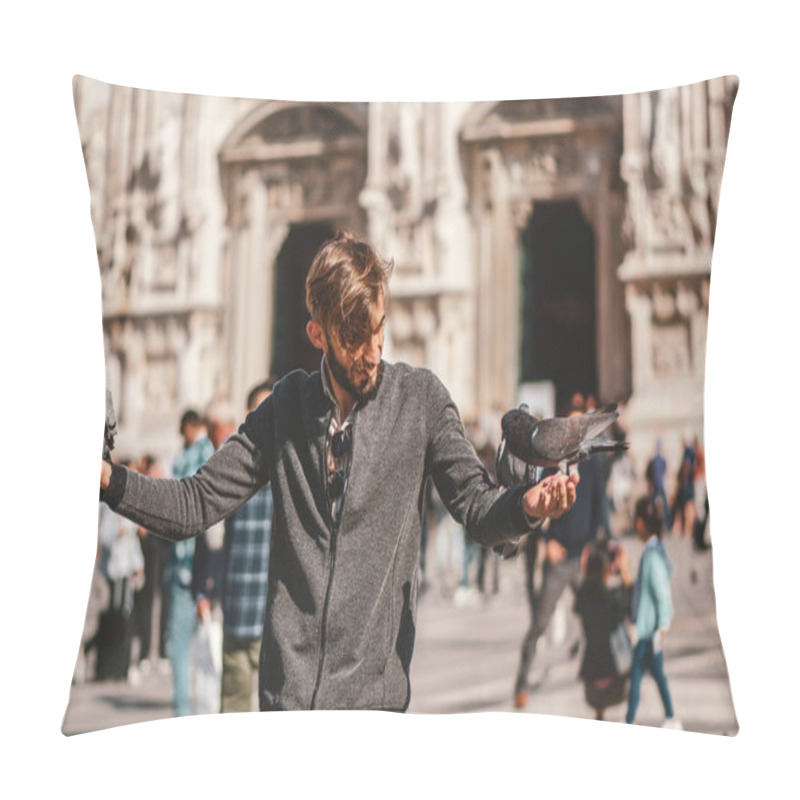 Personality  Happy Young man posing with pigeons in the Milanese street with ancient church Duomo di Milano on background. Cute happy 23 years old man posing in Milan, Italy. pillow covers