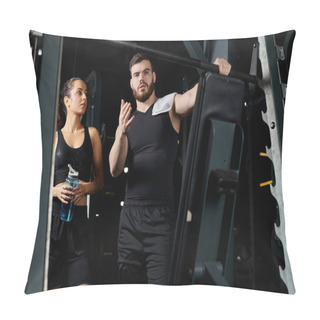 Personality  A Male Personal Trainer Stands Next To A Brunette Sportswoman In A Gym, Motivating And Guiding Her Through A Workout Session. Pillow Covers