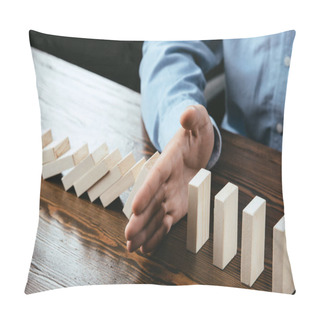 Personality  Cropped View Of Man Sitting At Desk And Preventing Wooden Blocks From Falling  Pillow Covers