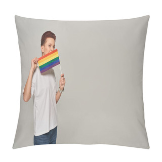 Personality  Redhead Queer Model In White T-shirt Posing With Small LGBT Flat Near Face Looking At Camera On Grey Pillow Covers