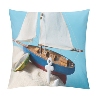 Personality  Miniature Ship Near Compass And Anchor In White Sand Isolated On Blue Pillow Covers