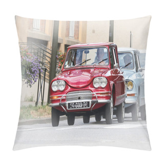 Personality  A Beautiful Model Of Citroen Ami 8 In Shining Red Color Driving Down A City Street. Pillow Covers
