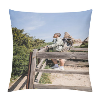 Personality  Side View Of Young Short Haired Female Tourist With Backpack And Travel Equipment Looking Away While Standing On Hill With Wooden Fence And Nature At Background, Hiker Trekking Through Landscape Pillow Covers