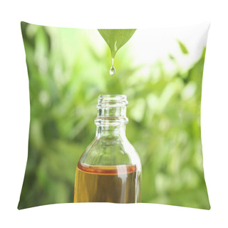 Personality  Essential Oil Dripping From Leaf Into Glass Bottle On Blurred Background Pillow Covers