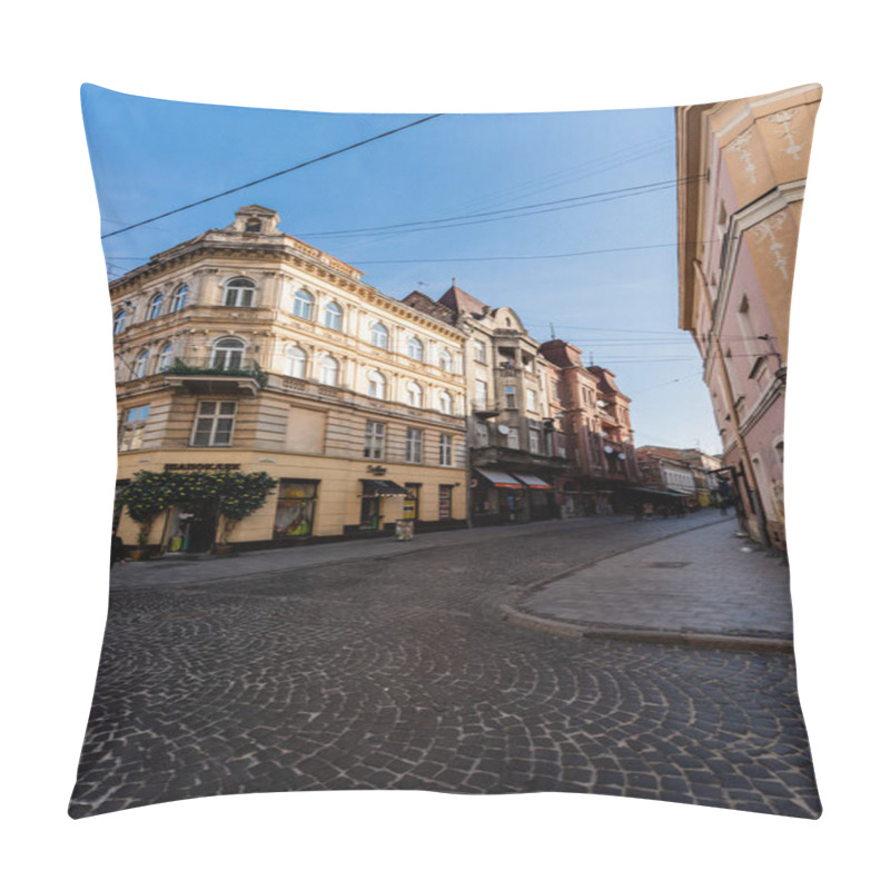 Personality  LVIV, UKRAINE - OCTOBER 23, 2019: old house with entrance decorated with lemon trees in flowerpots and cyrillic lettering  pillow covers