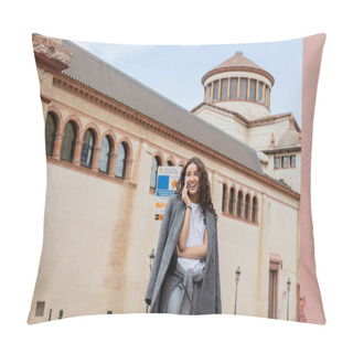 Personality  Smiling Young And Curly Woman In Warm Jacket And Casual Clothes Talking On Smartphone And Looking Away While Standing Near Historic Landmark On Urban Street In Barcelona, Spain, Ancient Building Pillow Covers