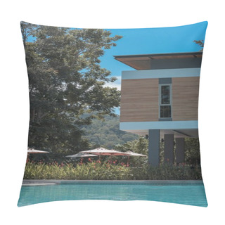 Personality  A Vertical Shot Of A House With A Big Pool Surrounded By A Green Scenery Pillow Covers