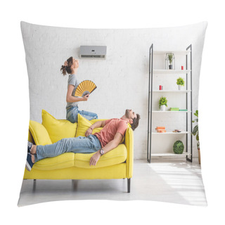 Personality  Exhausted Man Lying On Yellow Sofa Under Air Conditioner Near Woman With Hand Fan Pillow Covers
