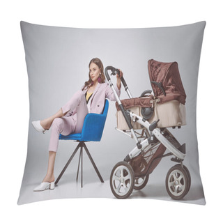 Personality  Stylish Woman Holding Baby Stroller While Sitting On Chair And Looking Away On Grey Pillow Covers