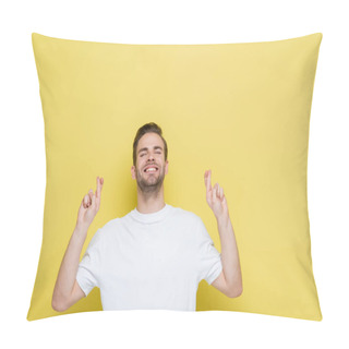Personality  Cheerful Man With Closed Eyes Standing With Crossed Fingers On Yellow Pillow Covers