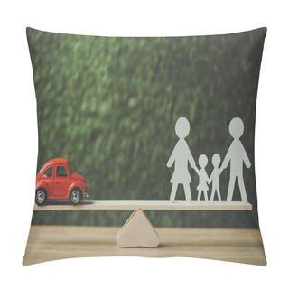 Personality  Red Miniature Car And Paper Cut Family Balancing On Swing On Green Background Pillow Covers