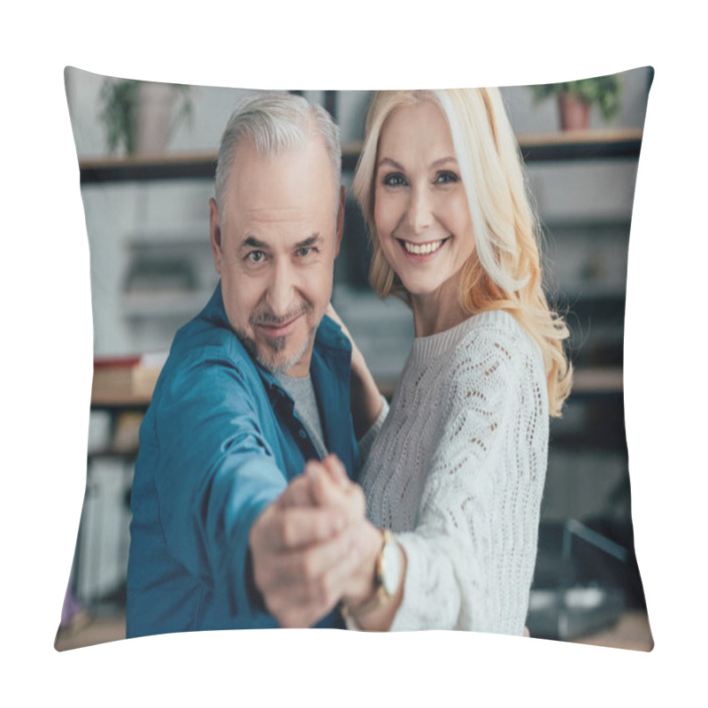 Personality  selective focus of happy husband and wife holding hands while dancing pillow covers