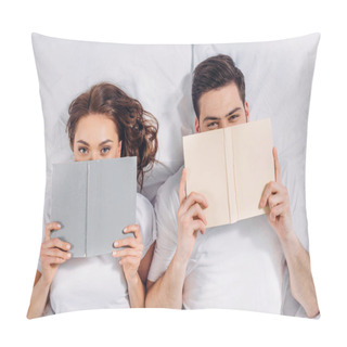 Personality  Overhead View Of Young Couple Covering Faces With Books While Lying In Bed Pillow Covers
