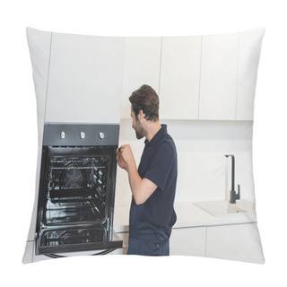 Personality  Workman Repairing Electric Built-in Oven In Modern Kitchen Pillow Covers