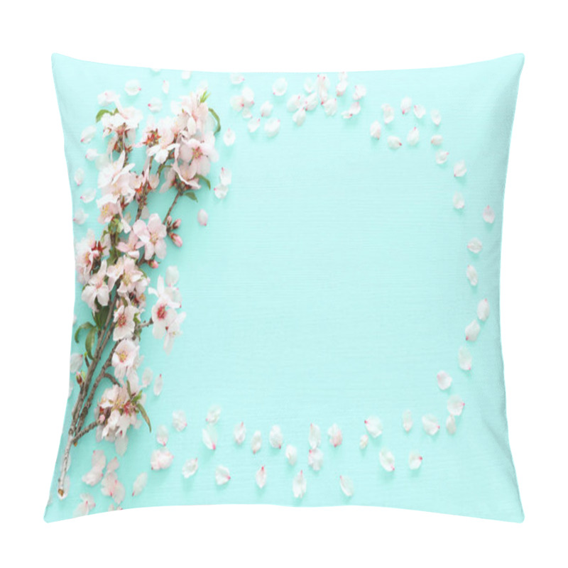 Personality  photo of spring white cherry blossom tree on pastel mint wooden background. View from above, flat lay pillow covers