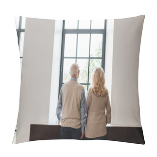 Personality  Back View Of Upset Elderly Couple Looking Through Window At Home On Quarantine Pillow Covers
