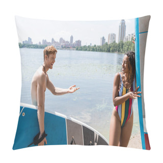 Personality  Happy Redhead Man Holding Sup Board And Talking To Enchanting African American Woman In Colorful Swimsuit Near Lake And Cityscape On Background In Summer Pillow Covers