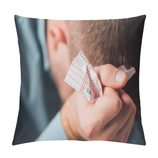 Personality  Selective Focus Of Unhappy Man Sitting With Bowed Head While Holding Crumpled Lottery Ticket Pillow Covers