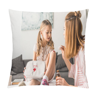 Personality  Beautiful Mother Treating Injured Daughter With Antiseptic At Home Pillow Covers