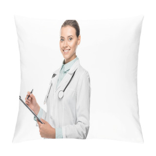 Personality  Smiling Young Female Doctor In Medical Coat Writing In Clipboard Isolated On White Pillow Covers